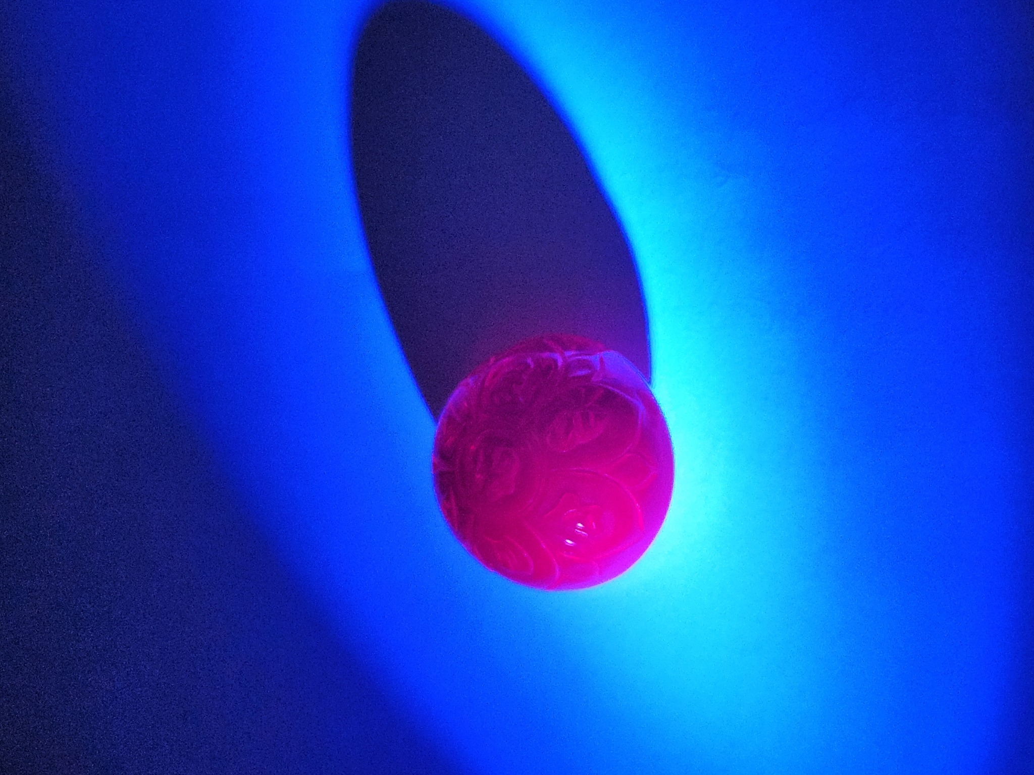 Ruby under 365 nm UV — red luminescence
